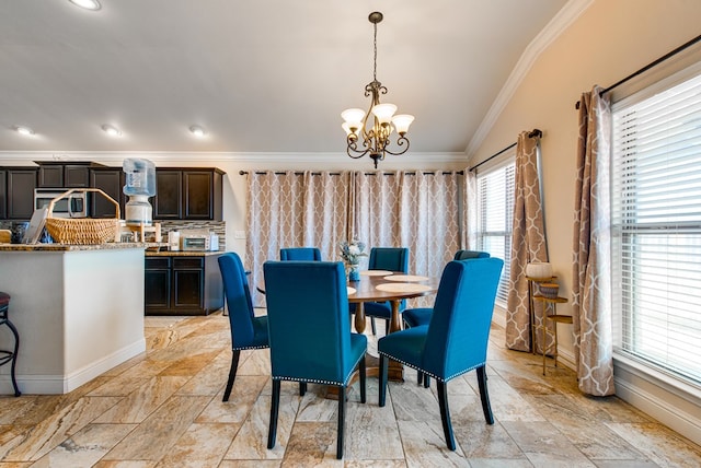 418 Orourke, Midland, TX 79706 - dining room with ornamental molding, a chandelier, baseboards, and light stone finish flooring