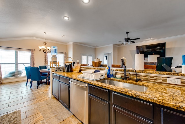 418 Orourke, Midland, TX 79706 - kitchen with stainless steel dishwasher, a sink, a chandelier, light stone countertops, and dark brown cabinets