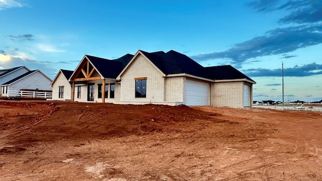 2815 S County Rd 1092, Midland, TX 79706 - view of front of house with brick siding and a garage