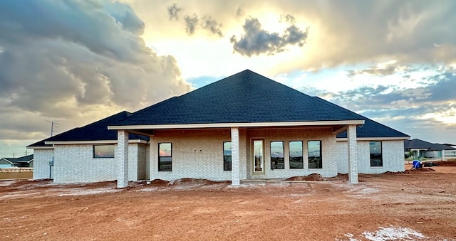 2815 S County Rd 1092, Midland, TX 79706 - rear view of house featuring brick siding and a shingled roof