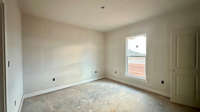 2815 S County Rd 1092, Midland, TX 79706 - unfurnished room with unfinished concrete flooring and baseboards