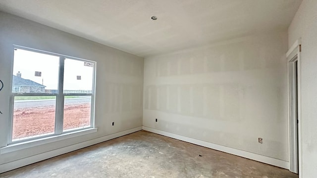 2815 S County Rd 1092, Midland, TX 79706 - spare room with unfinished concrete floors and plenty of natural light