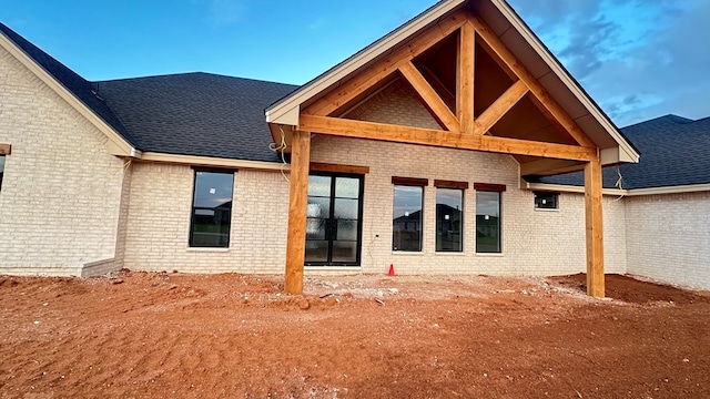 2815 S County Rd 1092, Midland, TX 79706 - rear view of house featuring brick siding and roof with shingles