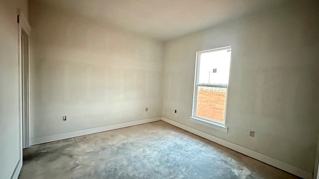 2815 S County Rd 1092, Midland, TX 79706 - empty room featuring unfinished concrete floors and baseboards
