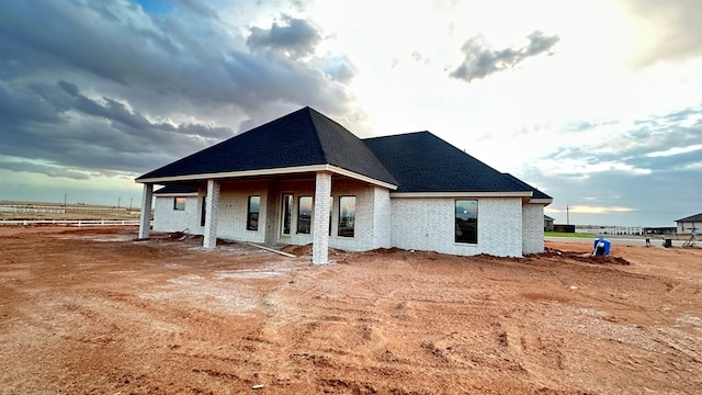 2815 S County Rd 1092, Midland, TX 79706 - rear view of house featuring brick siding and a shingled roof