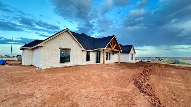 2815 S County Rd 1092, Midland, TX 79706 - view of front of home with brick siding and roof with shingles