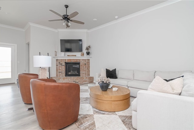 2013 Swenson St, Midland, TX 79705 - living area with ornamental molding, a fireplace, a ceiling fan, and light wood-style flooring