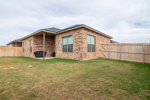 2013 Swenson St, Midland, TX 79705 - rear view of property featuring a patio area and brick siding