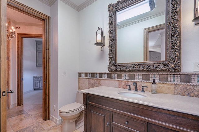 bathroom with crown molding, vanity, backsplash, and toilet