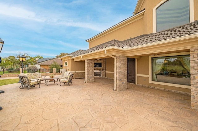 view of patio / terrace with fence and outdoor lounge area