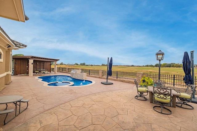 view of swimming pool with a patio, an in ground hot tub, fence, and a pergola