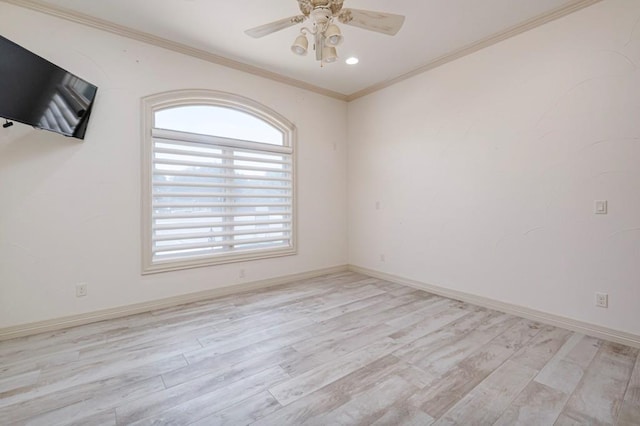 unfurnished room with crown molding, light wood-style flooring, ceiling fan, and baseboards
