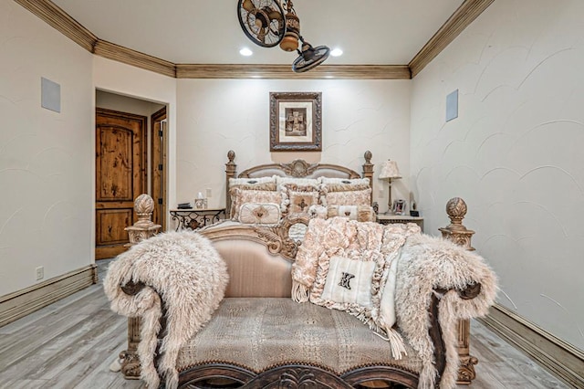 bedroom featuring baseboards, ornamental molding, recessed lighting, and wood finished floors