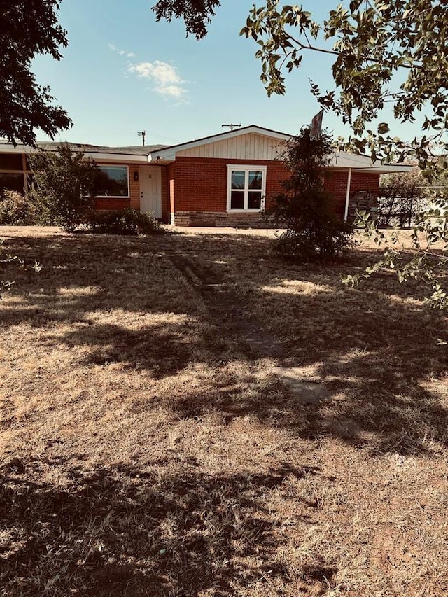 exterior space with brick siding