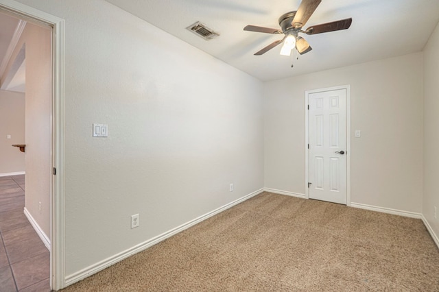 carpeted empty room with ceiling fan