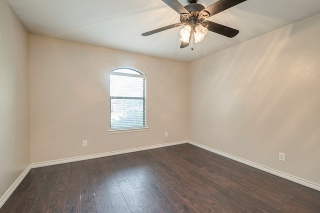 spare room featuring ceiling fan and dark hardwood / wood-style floors