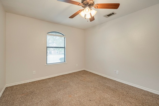 unfurnished room with ceiling fan and carpet flooring