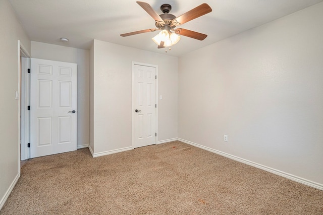 unfurnished bedroom with ceiling fan, a closet, and carpet