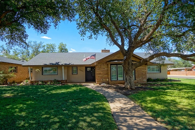 3000 Sentinel Ave, Midland, TX 79701 - ranch-style home featuring a front lawn, a chimney, and brick siding