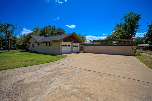 3000 Sentinel Ave, Midland, TX 79701 - view of side of property featuring a yard, an attached garage, driveway, and brick siding