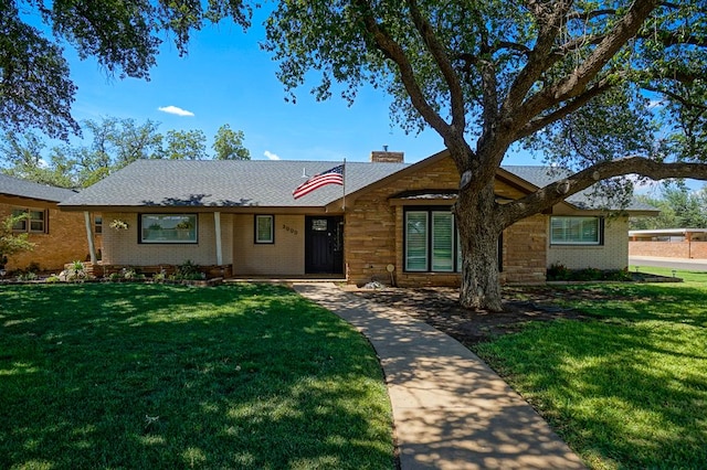 3000 Sentinel Ave, Midland, TX 79701 - ranch-style home featuring brick siding, a front lawn, and a chimney