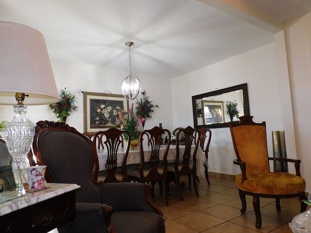 dining space featuring light tile patterned floors and an inviting chandelier