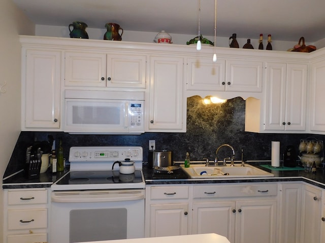 kitchen featuring white cabinets, backsplash, white appliances, and sink