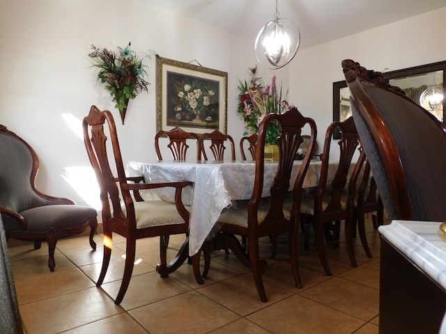 tiled dining area with a chandelier