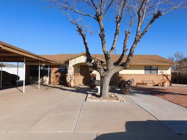 single story home featuring a patio area