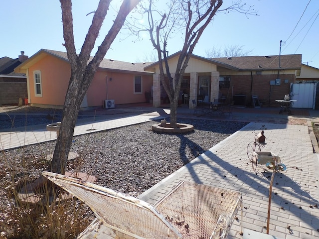 back of house with a patio