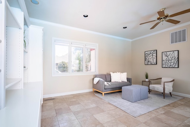 sitting room with ceiling fan and ornamental molding