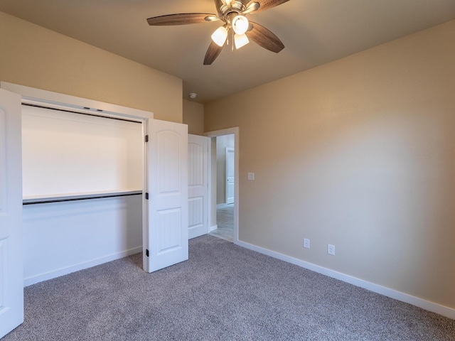 unfurnished bedroom featuring carpet floors, ceiling fan, baseboards, and a closet