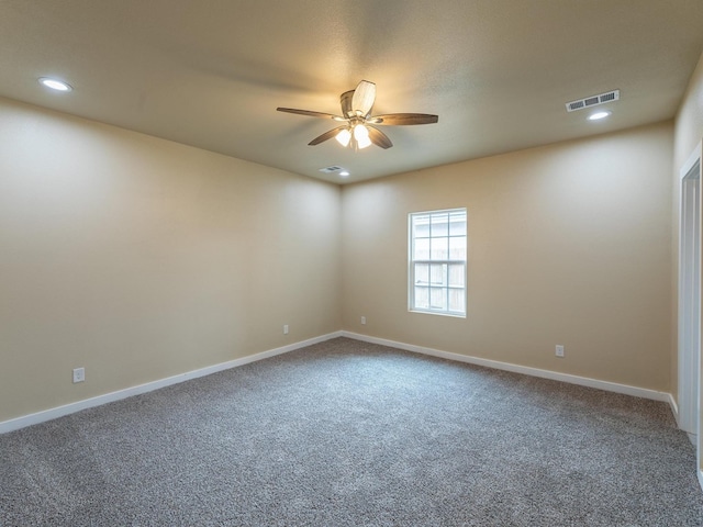 spare room with ceiling fan, visible vents, baseboards, and recessed lighting