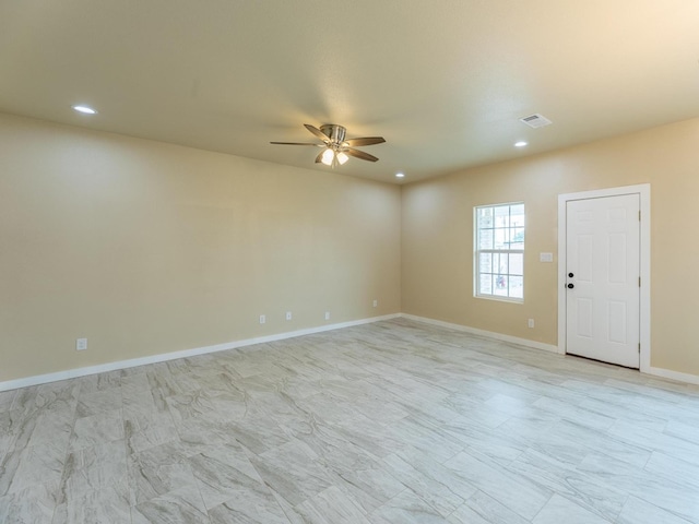 spare room with a ceiling fan, recessed lighting, visible vents, and baseboards