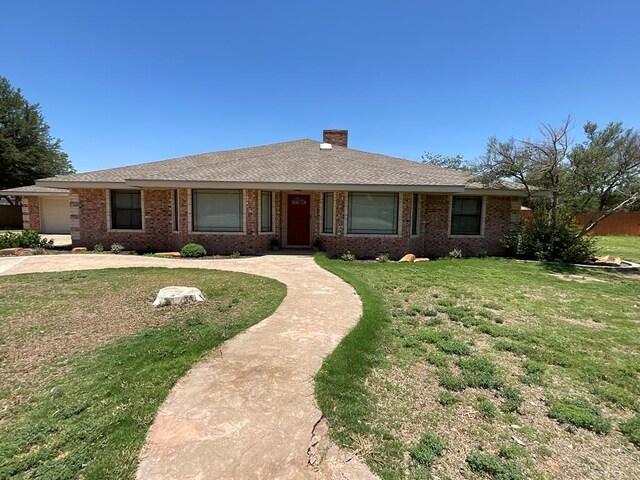 3320 Lancewood Ln, Odessa, TX 79762 - ranch-style house featuring a chimney