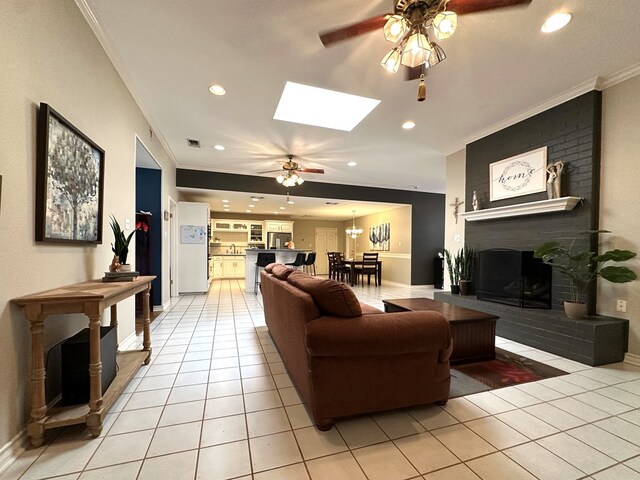 3320 Lancewood Ln, Odessa, TX 79762 - living area featuring a ceiling fan, ornamental molding, a brick fireplace, light tile patterned floors, and recessed lighting