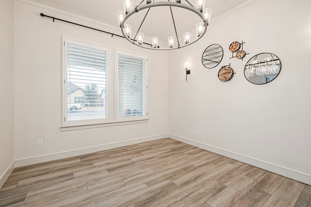 unfurnished dining area featuring light wood-type flooring and a chandelier