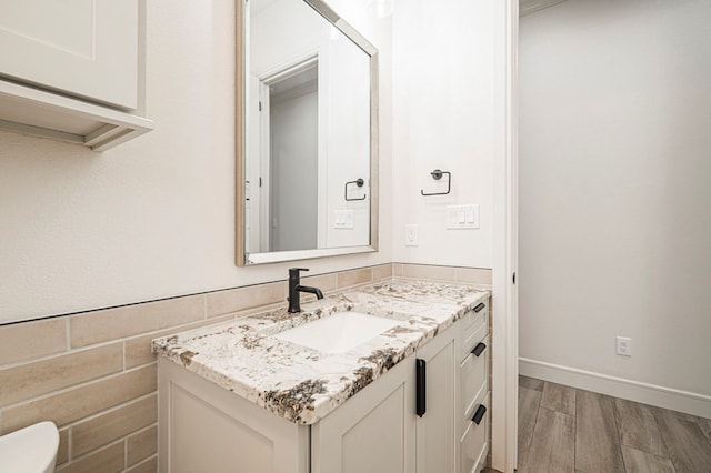 bathroom featuring wood-type flooring and vanity