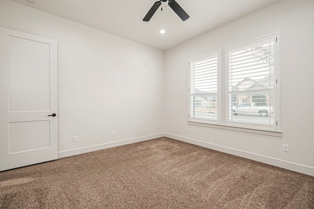 empty room featuring ceiling fan and carpet flooring