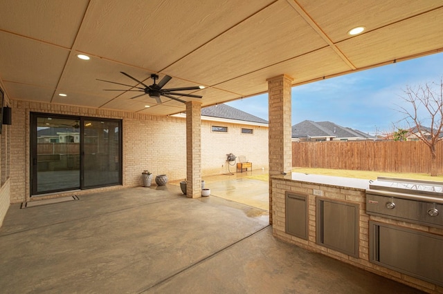 view of patio / terrace featuring an outdoor kitchen, ceiling fan, and area for grilling