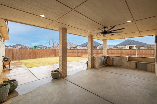 view of patio / terrace featuring area for grilling and ceiling fan