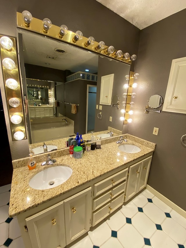 bathroom with a bathtub and vanity