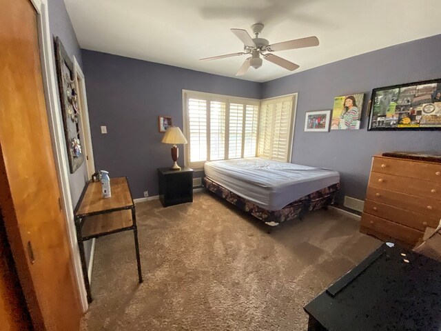 bedroom featuring ceiling fan and carpet floors