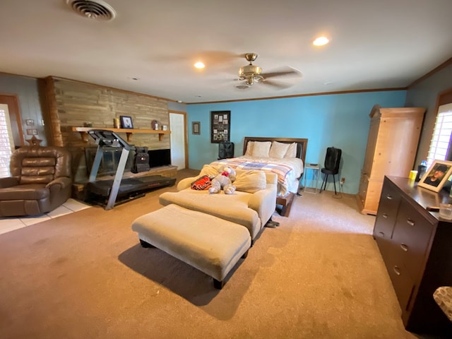 bedroom with ceiling fan, ornamental molding, and light carpet