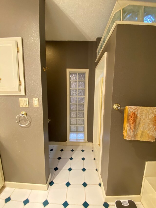 bathroom with a textured ceiling