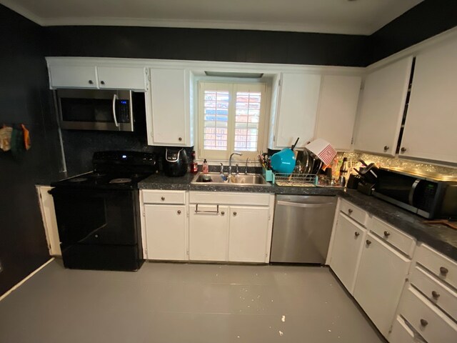 kitchen featuring decorative backsplash, stainless steel appliances, white cabinetry, and sink