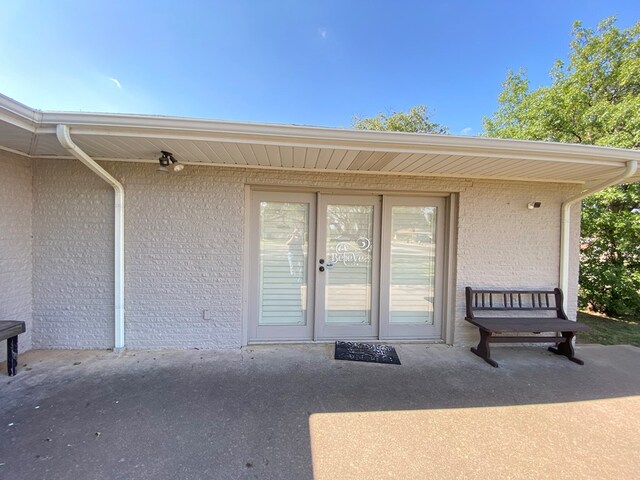 property entrance with a patio