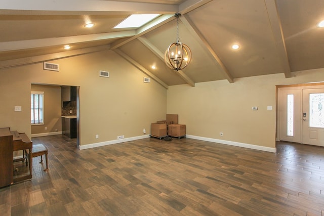 unfurnished living room featuring a chandelier, dark hardwood / wood-style flooring, and lofted ceiling with beams