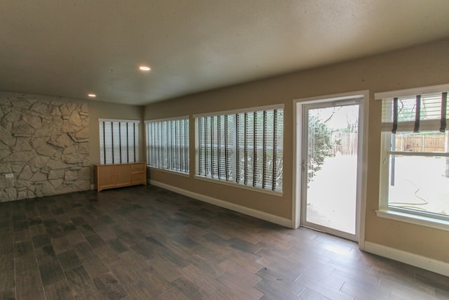 unfurnished room featuring dark hardwood / wood-style flooring