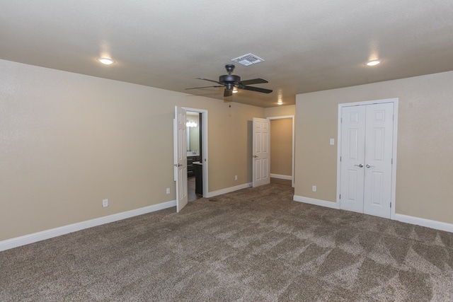 unfurnished bedroom featuring ceiling fan, a closet, carpet, and a textured ceiling